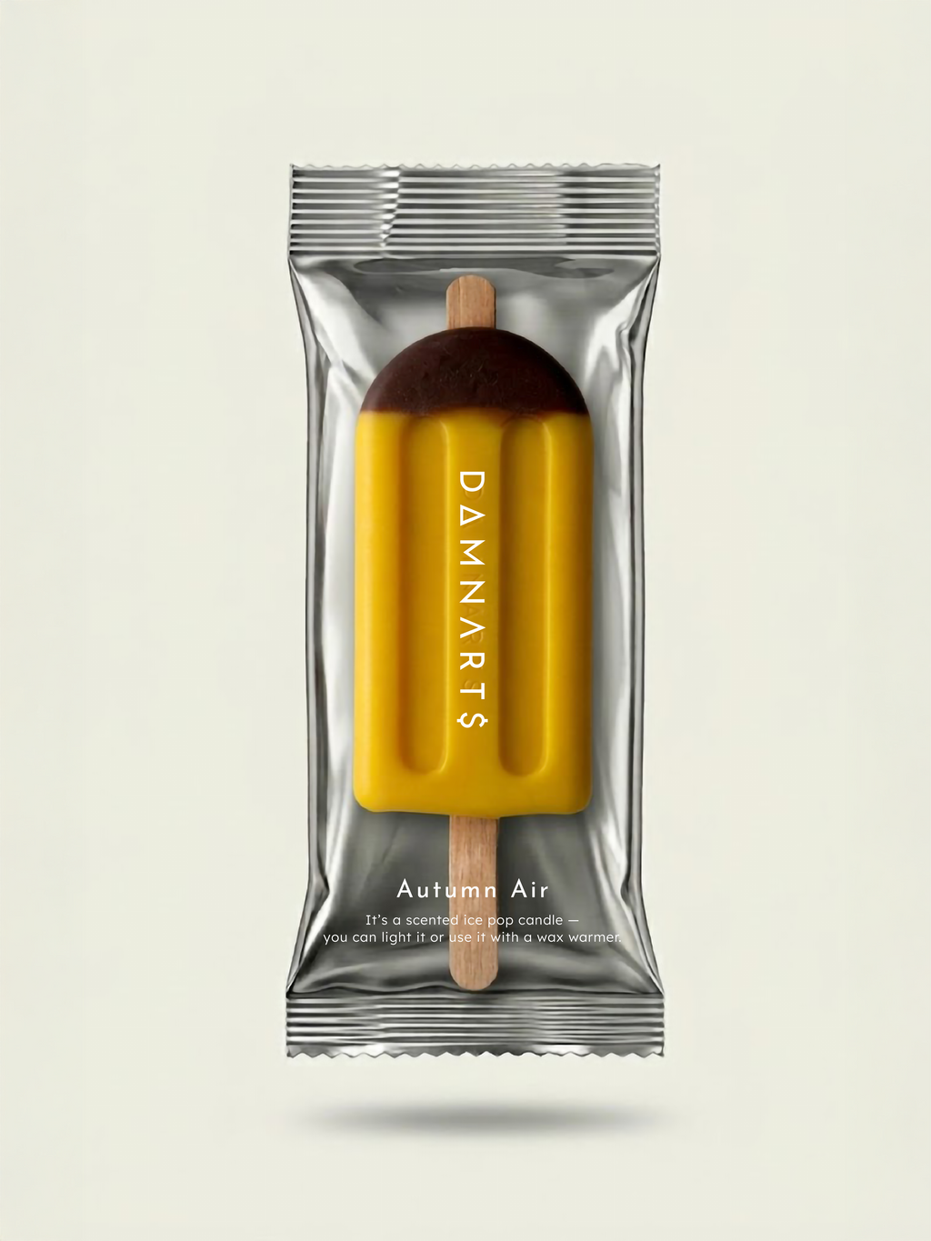 DAMNARTS Autumn Air scented ice pop candle in packaging, modern design product