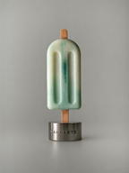 DAMNARTS Ocean Breeze scented ice pop candle on metal base, minimalist product shot